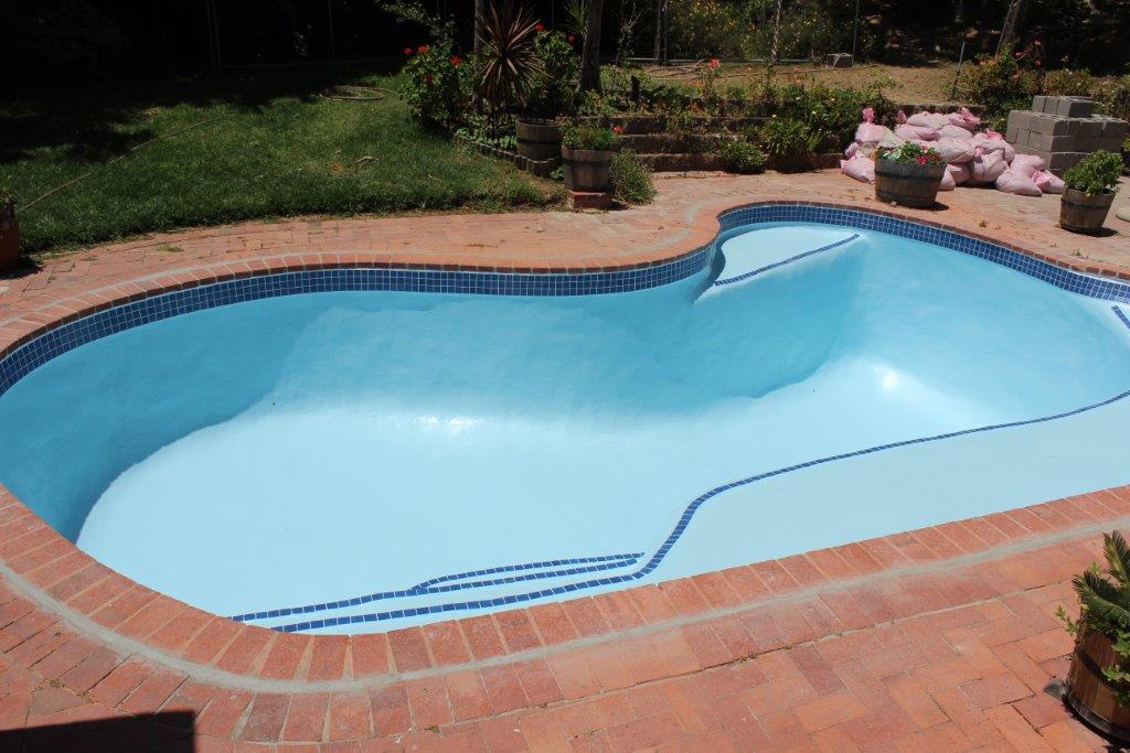 Fibreglass Lining Mosaic Tiles Hout Bay New-fibreglass-lining-applied-to-pool-ceramic-mosaic-pool-tiles-applied-to-sides,-martini-seat-and-step-area-of-pool.
