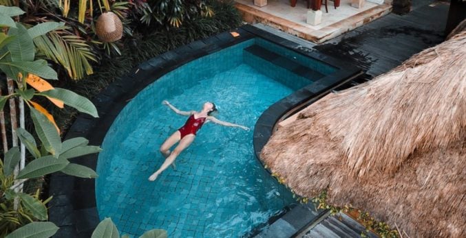 woman floating in the swimming pool